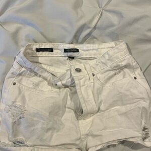 White ripped shorts